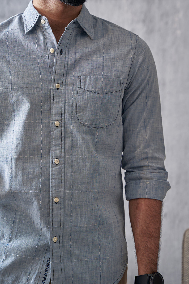 Chambray checks with woven designs.