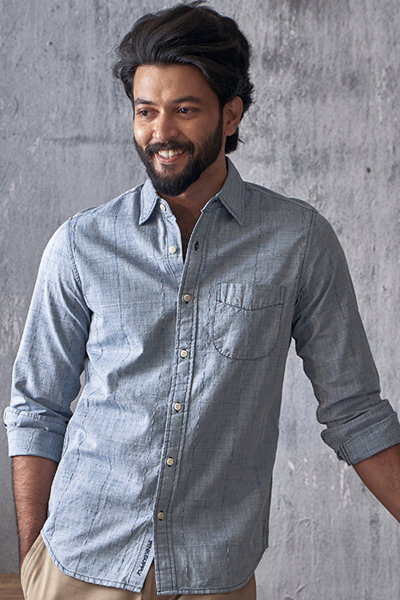 Chambray checks with woven designs.