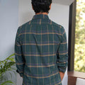 back view of madras checks shirt in green full sleeves