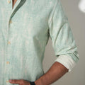 button and collar view of moss green printed cotton shirt