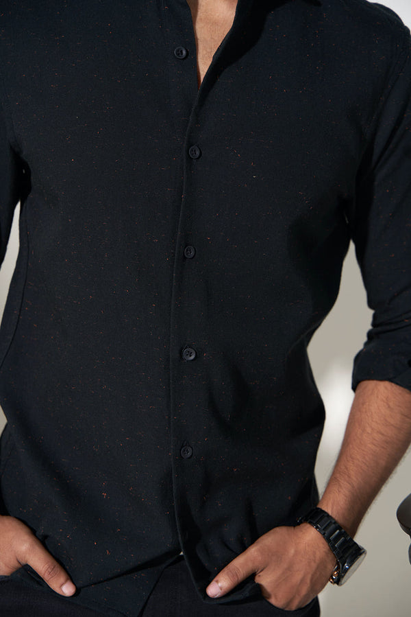 close view of black shirt with red sparkles