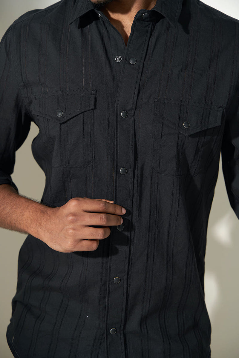 man showcasing close view of classy black dobby shirt 