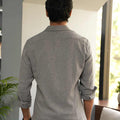 man showing back style of premium grey dobby shirt