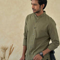 man wearing graceful green chinese collar cotton shirt