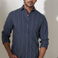 man wearing grey woven cotton shirt