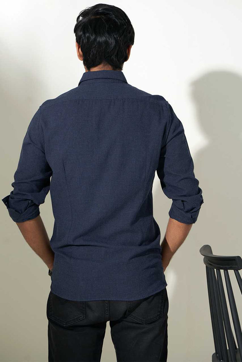 model showing back style of dark blue heather shirt