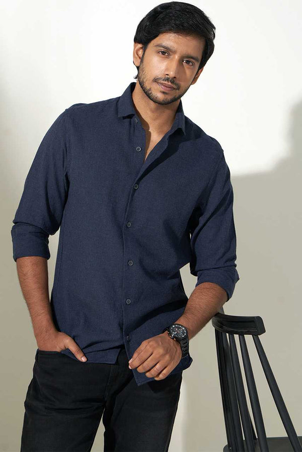 model wearing dark blue sustainable heather shirt