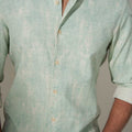 model wearing full sleeves moss green printed cotton shirt close view