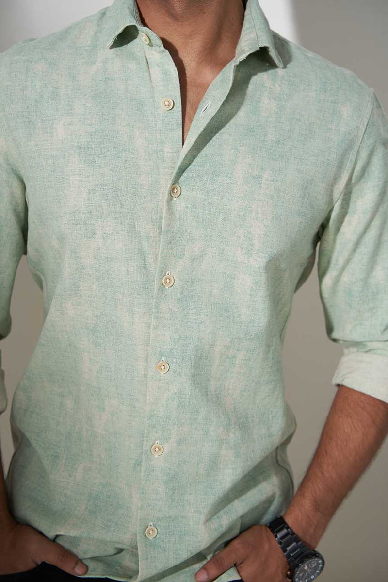 model wearing full sleeves moss green printed cotton shirt close view