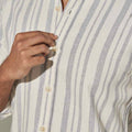 pink supply ivory striped cotton shirt close up view